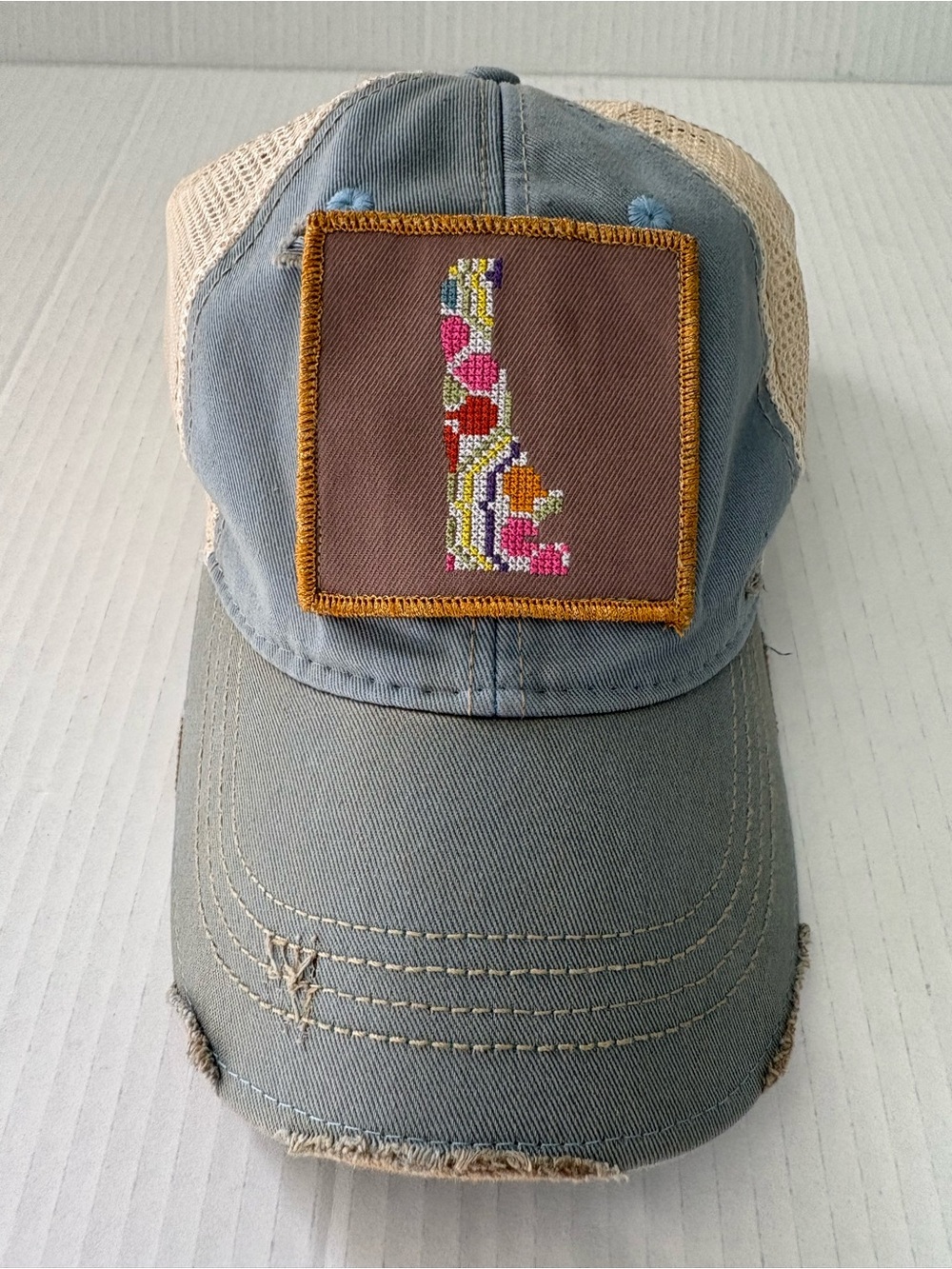 Judith March Distressed Trucker Hat state Delaware embroidery Patch blue tan